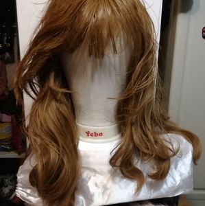 THE FAMOUS RED SYNTHETIC WIG.